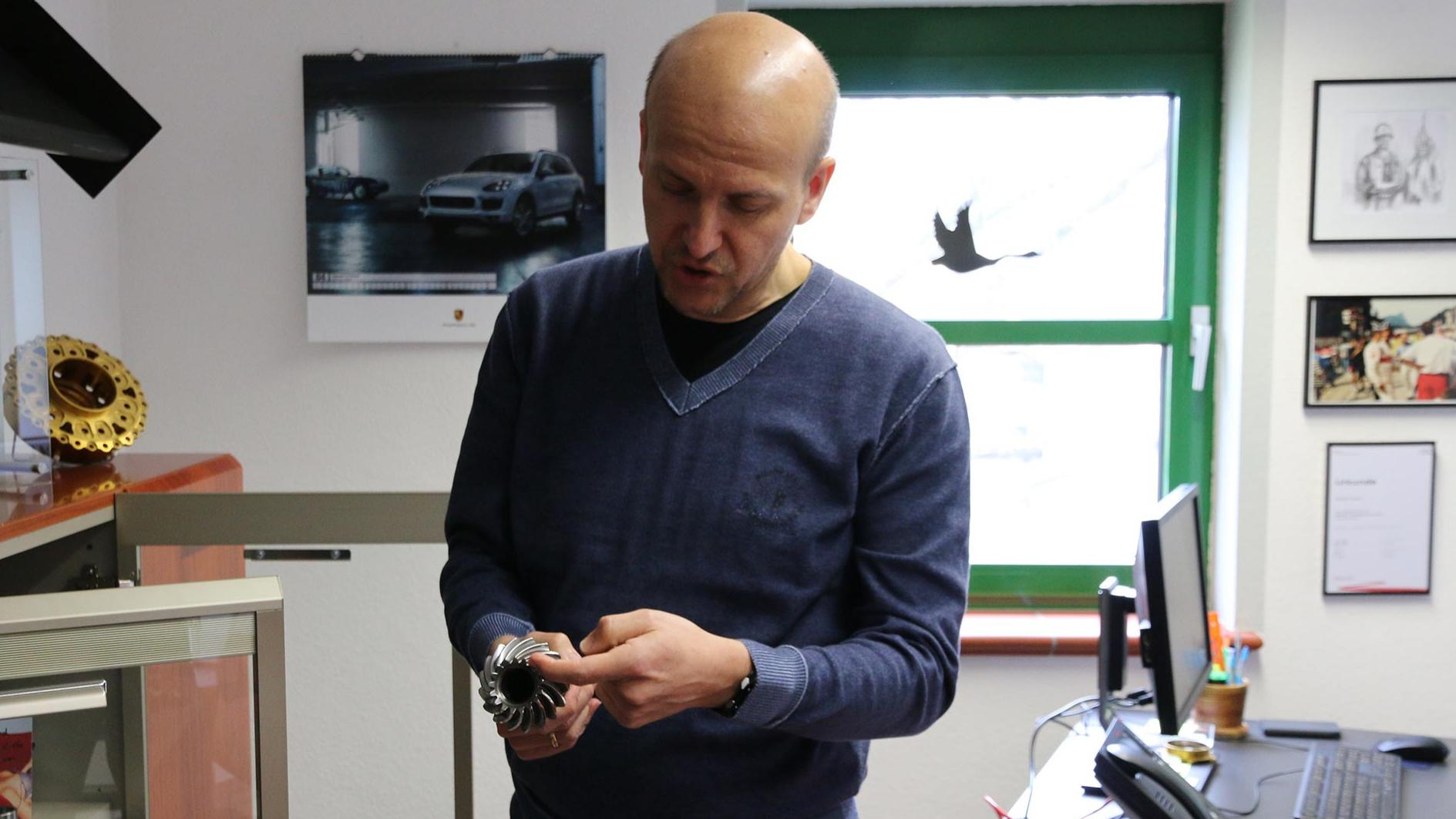 Company head Müller with one of his high-precision special parts