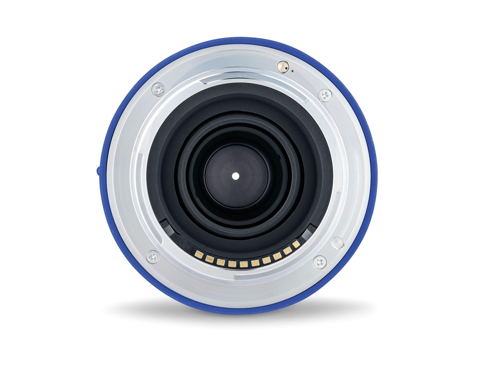 Close-up view of the rear element and electronic contact points of a ZEISS camera lens.