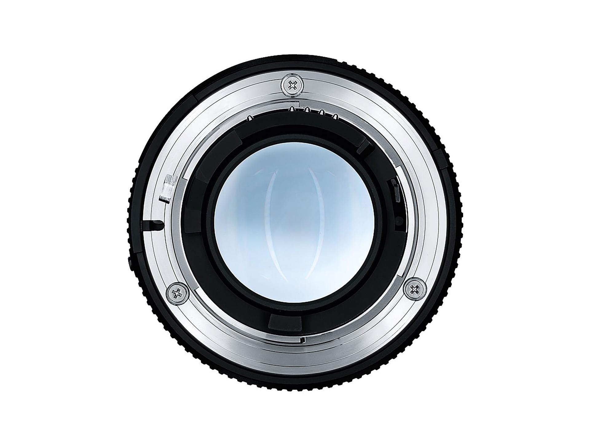 Two ZEISS camera lenses with black metal bodies and engraved focus markings are displayed side by side on a white background.