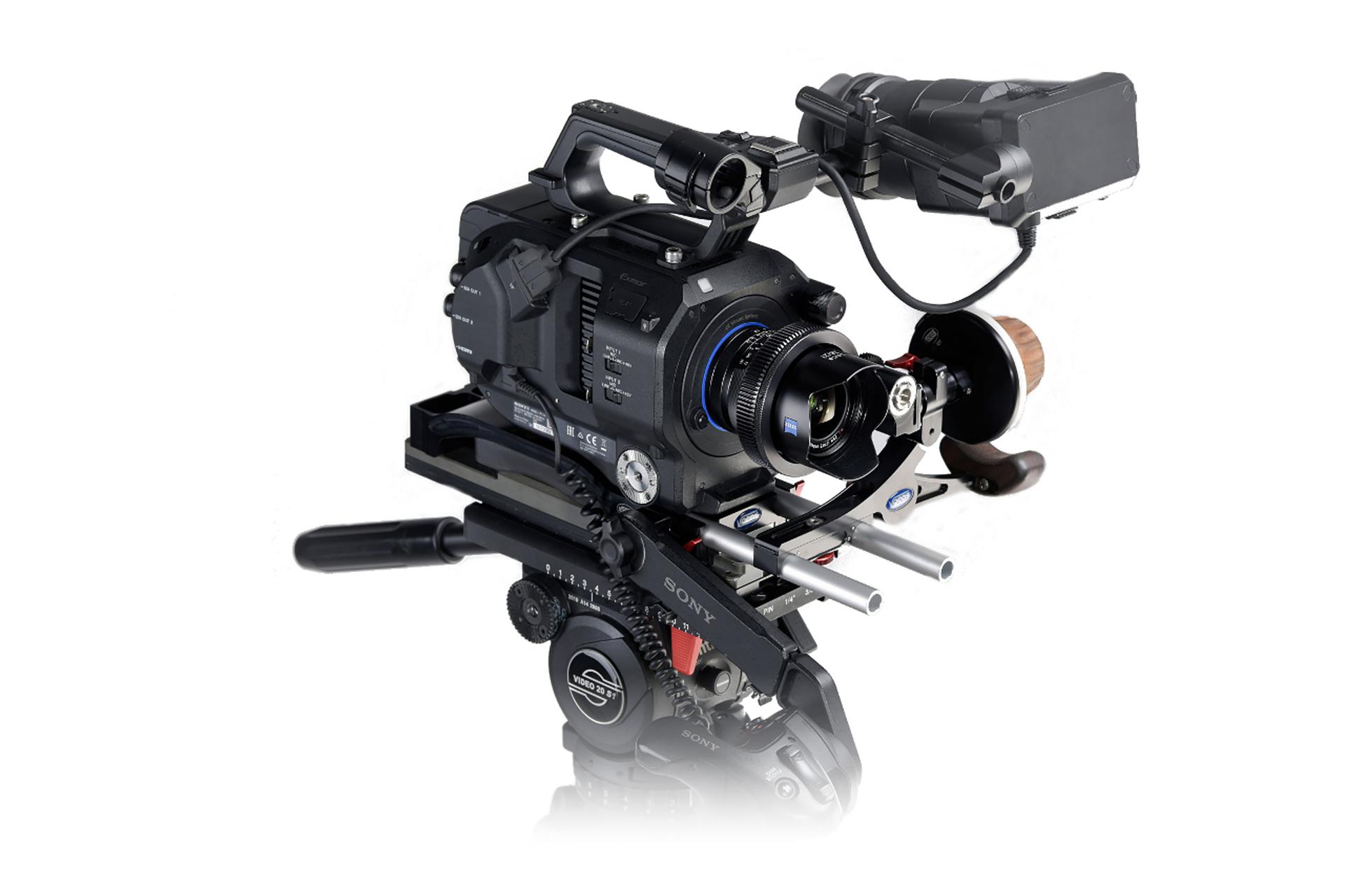 Professional cinema camera setup featuring a ZEISS lens mounted on a rig with various video production accessories.