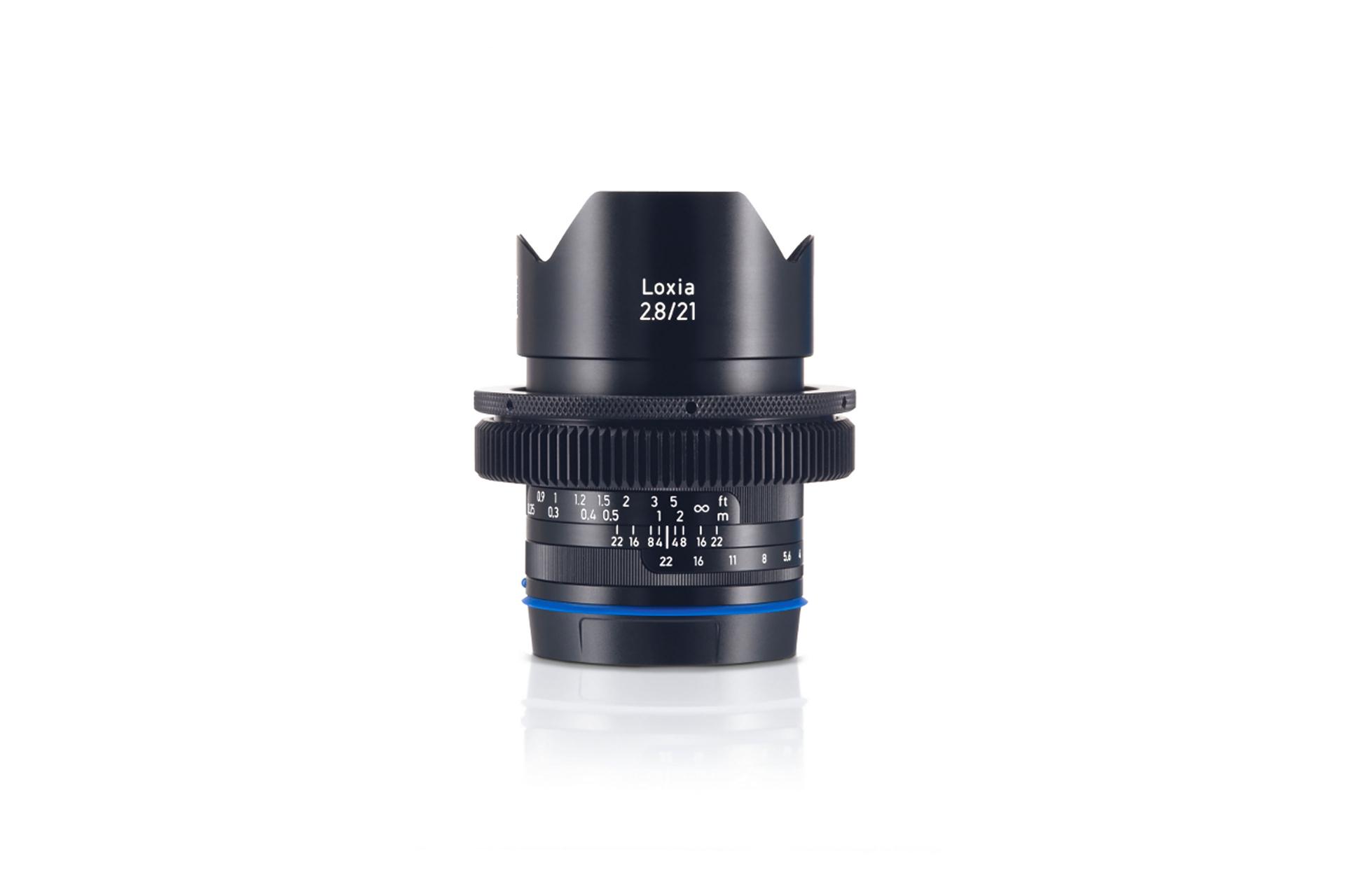 Front view of a ZEISS Loxia 2.8/21 camera lens with focus and aperture markings clearly visible.