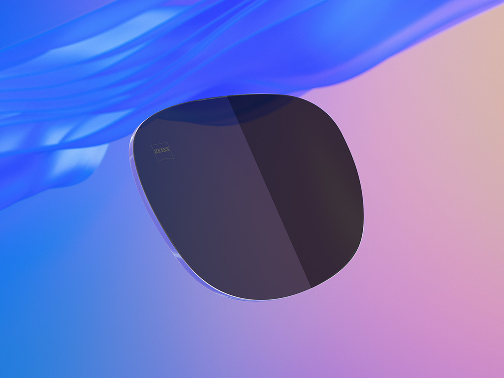 3D CGI-illustratie van een getint zonnebrilglas, waarbij de ene helft een lichtere kleurintensiteit heeft dan de andere.