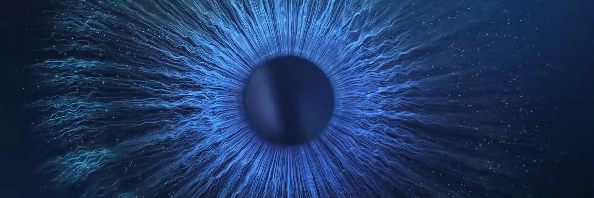 Daag de grenzen van de verbeelding uit - een close-up van een blauwe oogbol in het donker.